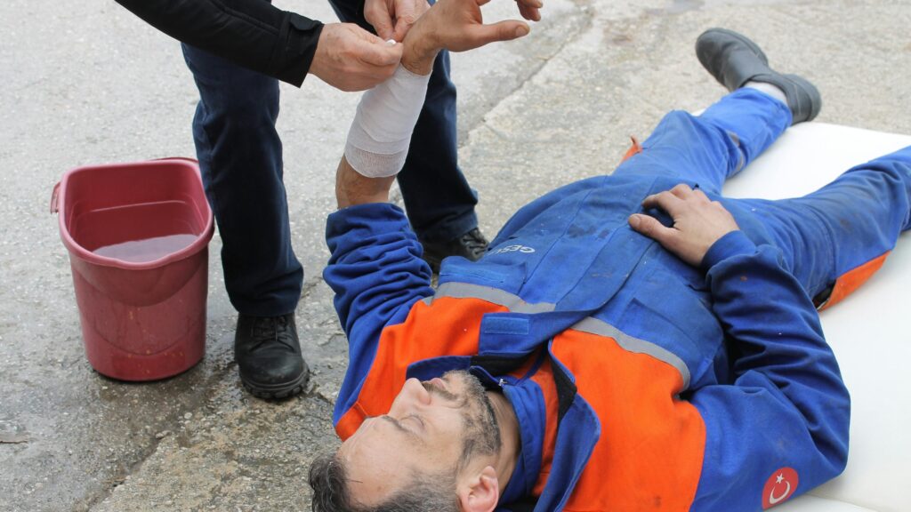 Industrial injury claims can be caused by slippery slopes and not providing safety guidelines like PPE and indications.